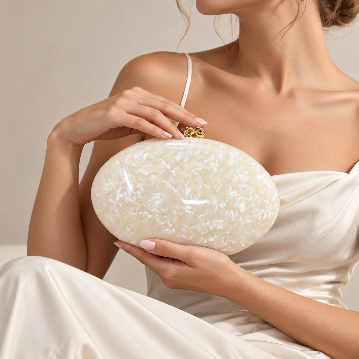 The Golden Twist Shell Clutch